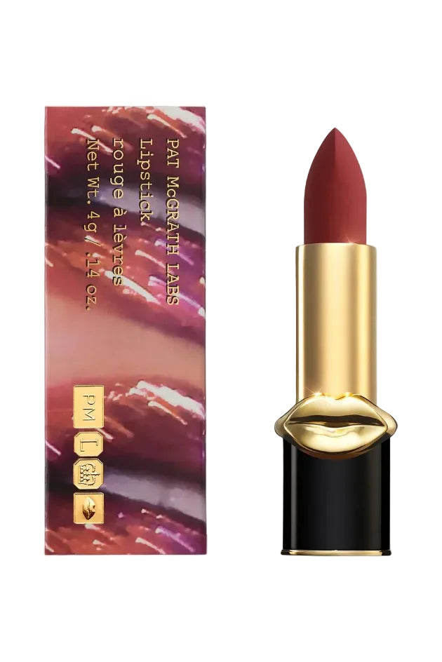 Pat McGrath Labs MatteTrance Lipstick shade Guinevere, deep crimson red matte lipstick with cool undertones, presented in elegant black and gold bullet packaging with gold lips design. Monza Outlet.