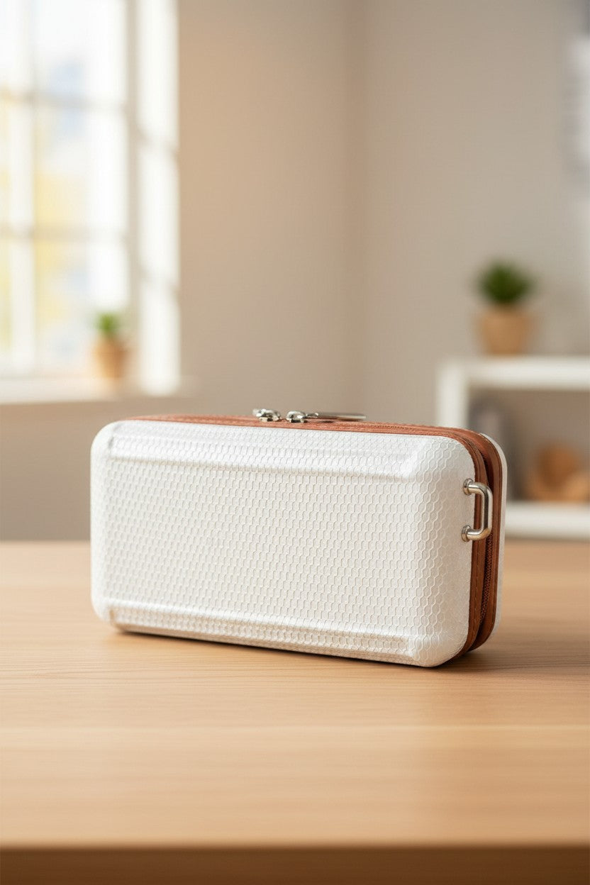 White textured rectangular device with brown accents on a wooden surface. Monza Outlet, Monza Fashion, Shein Outlet