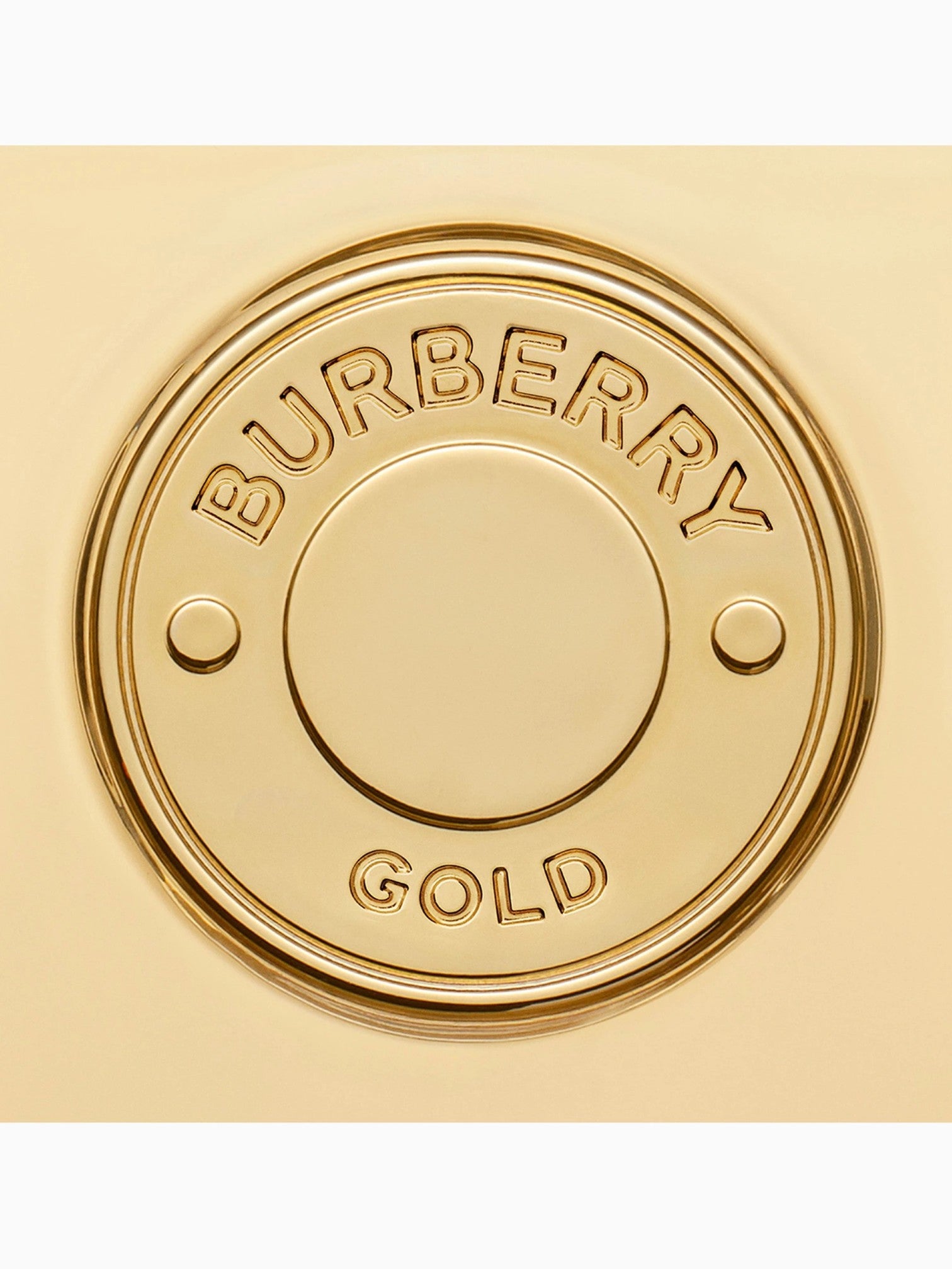 Gold Burberry product with 'Burberry Gold' text on a gold background. Burberry, Monza Outlet, Monza Fashion, Shein Outlet