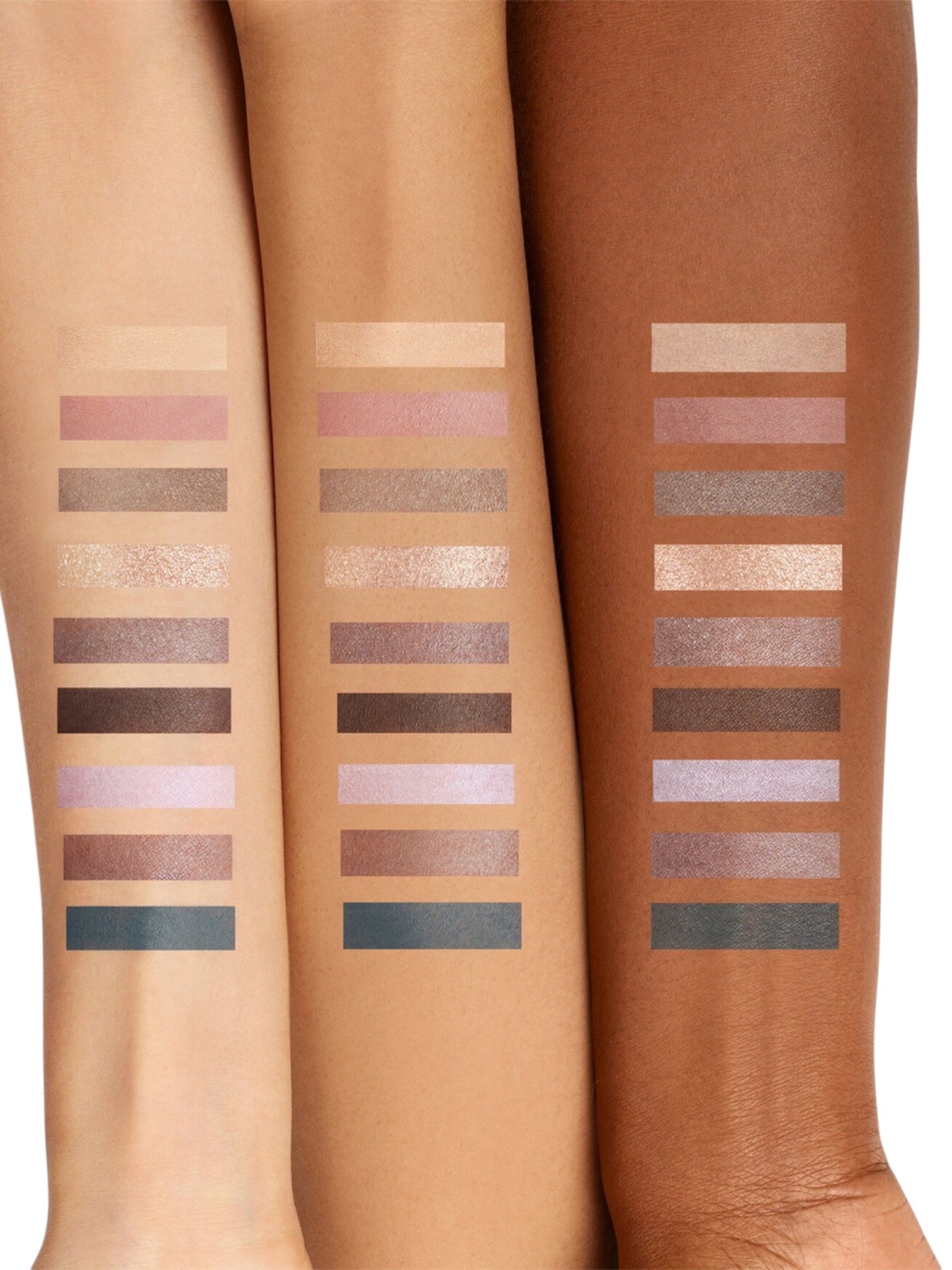 Three legs with swatches of makeup products on a neutral background. laura_mercier, Monza Outlet, Monza Fashion, Shein Outlet