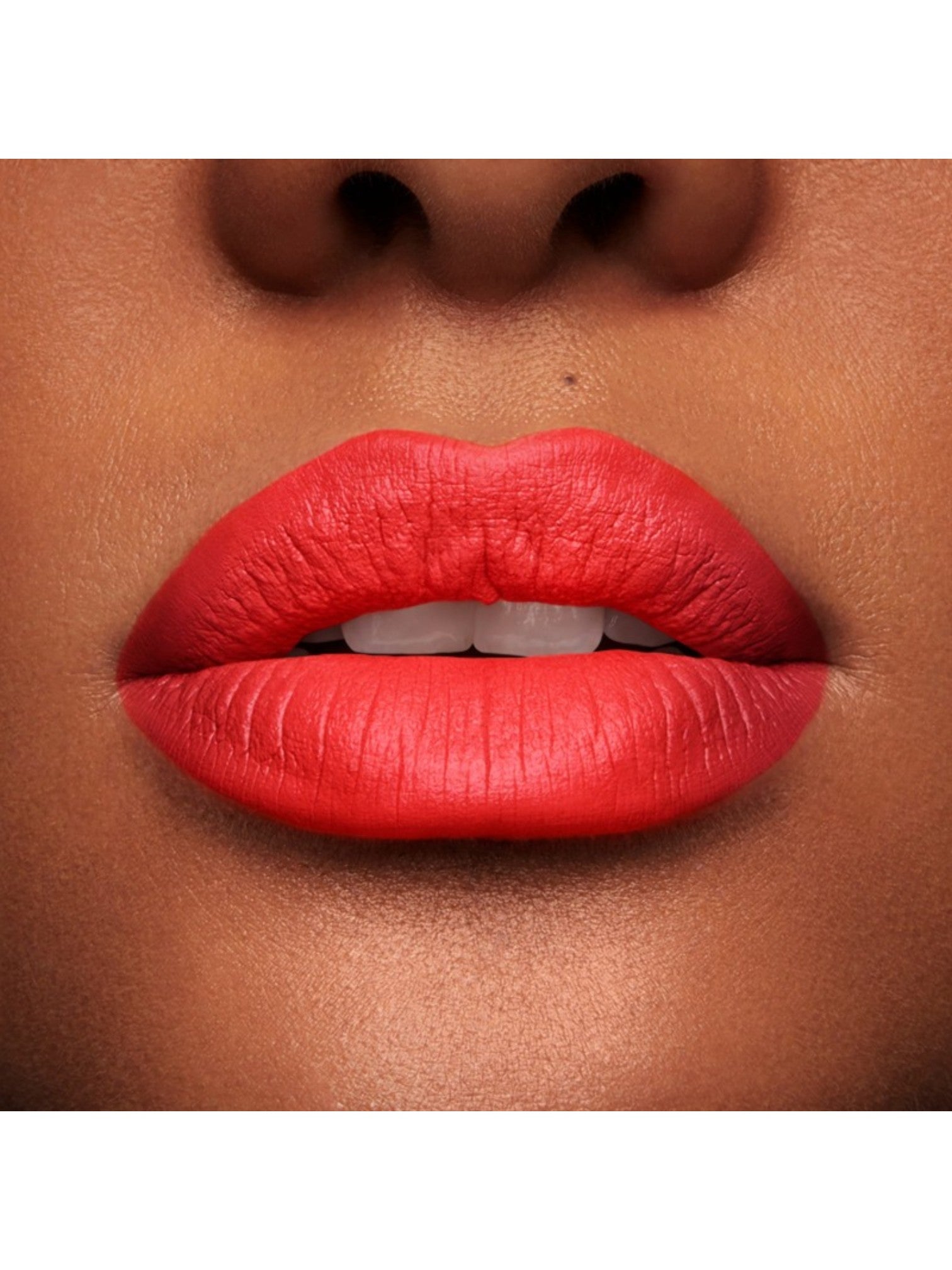 Close-up of a person's lips wearing a bright red lipstick on a neutral background. lancome, Monza Outlet, Monza Fashion, Shein Outlet