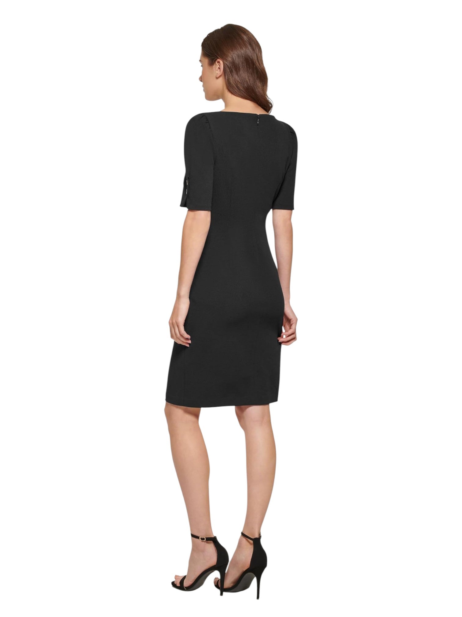 Woman wearing a black dress on a white background. DKNY, Monza Outlet, Monza Fashion, Shein Outlet