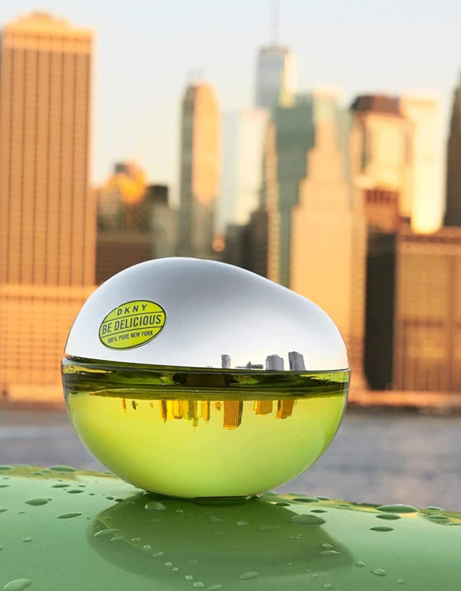 Spherical container with DC Delicious logo against a cityscape background. Dkny, Monza Outlet, Monza Fashion, Shein Outlet