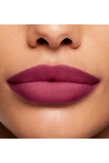 Close-up of a woman's lips with purple lipstick on a neutral background
