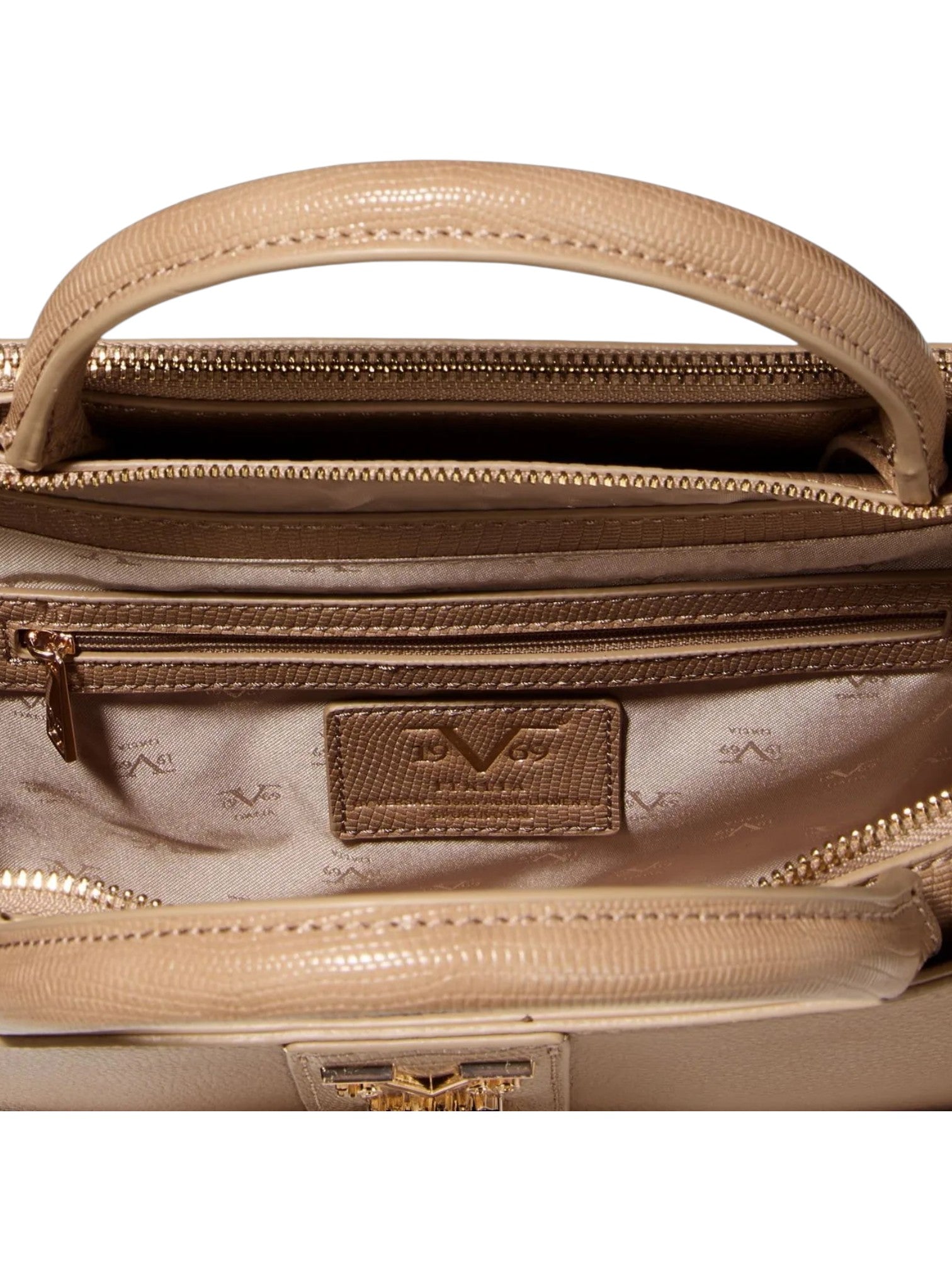 Close up of a beige leather handbag interior showing a top handle, zippered compartments, a patterned lining, and a branded patch. 19V69 Italia, Monza Outlet, Monza Fashion, Shein Outlet
