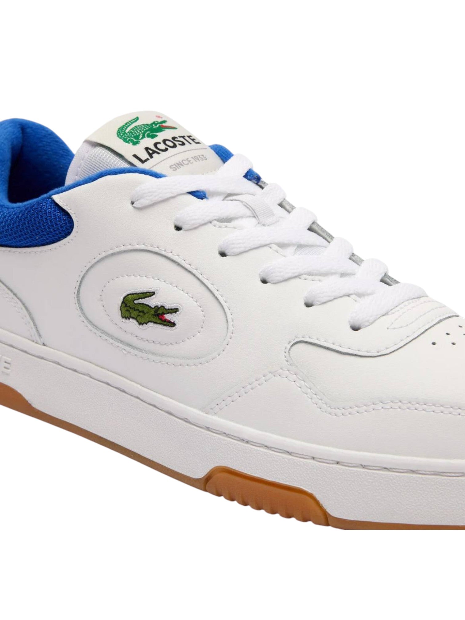 White sneaker with blue accents and Lacoste logo on a white background. Lacoste, Monza Outlet, Monza Fashion, Shein Outlet