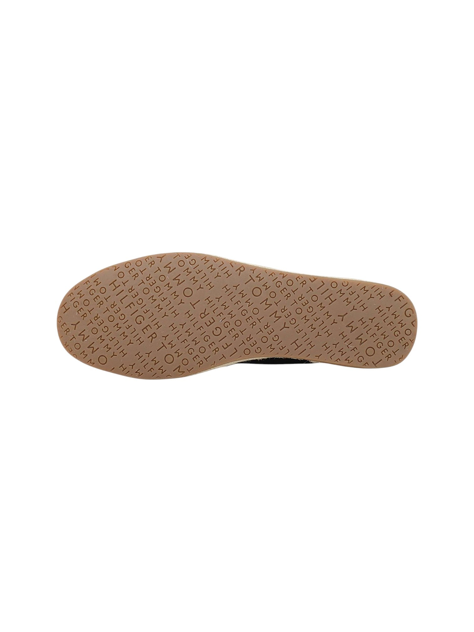 A top-down view of a shoe's tan rubber sole, featuring a textured pattern of repeating embossed brand names on a plain white background. Tommy Hilfiger, Monza Outlet, Monza Fashion, Shein Outlet