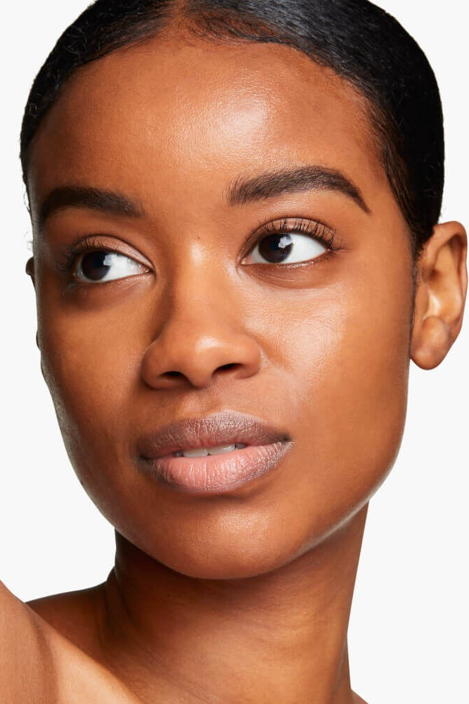 Close-up of a woman's face with a neutral background Monza fashion outlet, monza outlet, shein outlet, shien outlet cosmetics, makeup, perfume