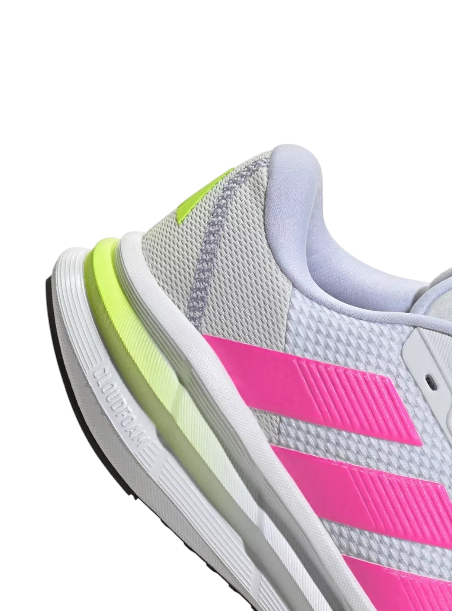 Close-up of a running shoe with pink and green accents on a white background. Adidas, Monza Outlet, Monza Fashion, Shein Outlet