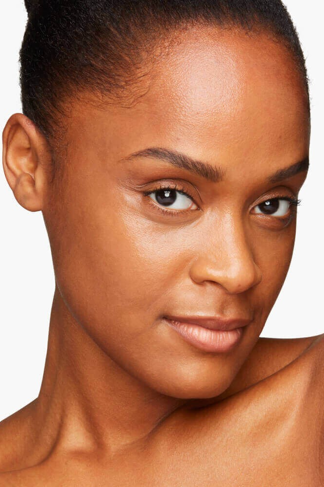Close-up of a woman's face with a neutral background Monza fashion outlet, monza outlet, shein outlet, shien outlet cosmetics, makeup, perfume