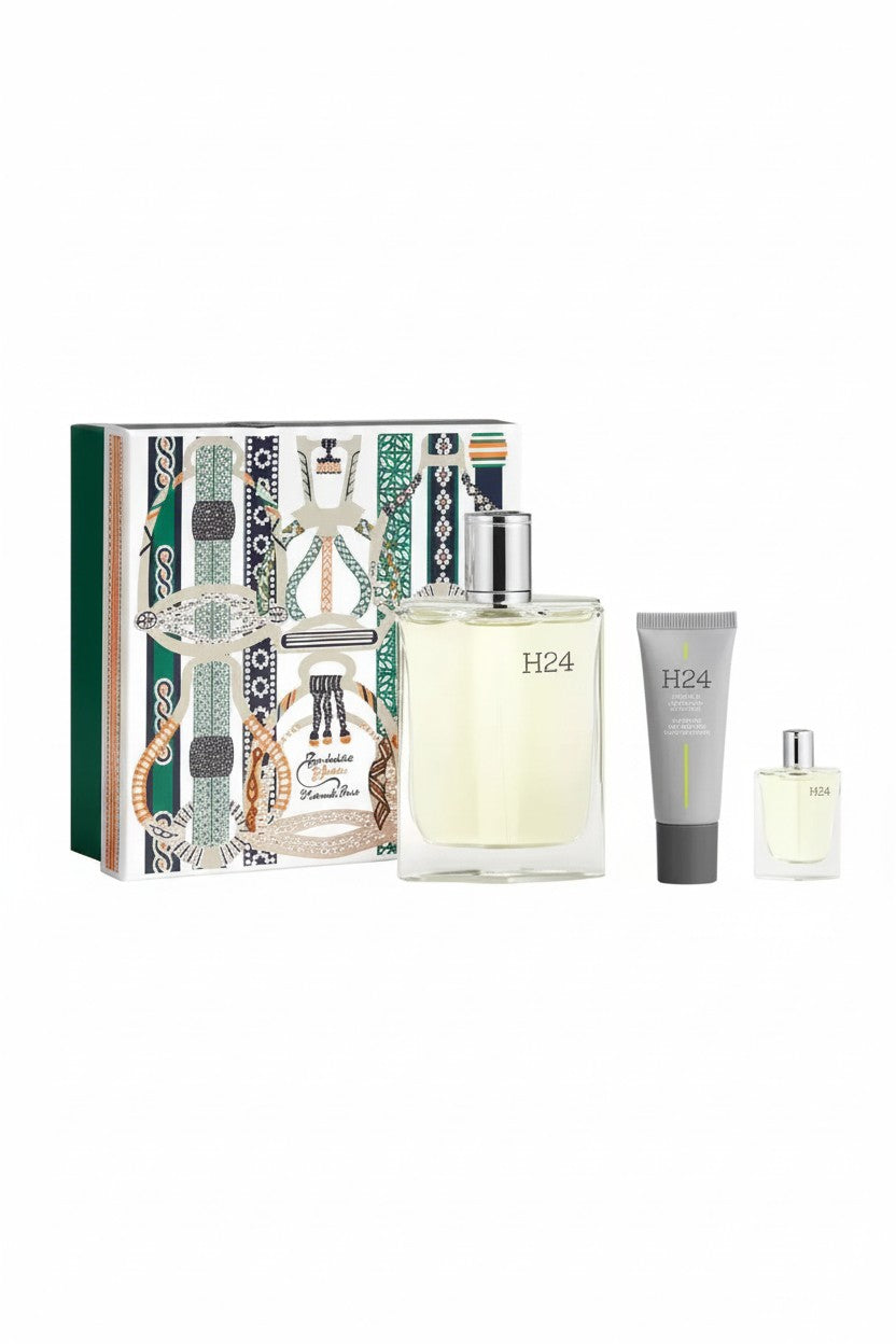 Hermès H24 fragrance gift set featuring a large rectangular perfume bottle, a gray body wash tube, a small travel spray bottle, and a decorative illustrated gift box on a white background. Hermes, Monza Outlet, Monza Fashion, Shein Outlet